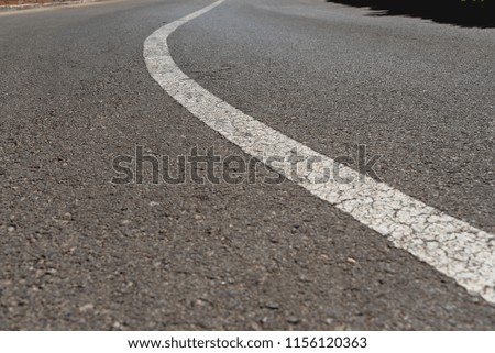White direction road lines with black background and space for text.