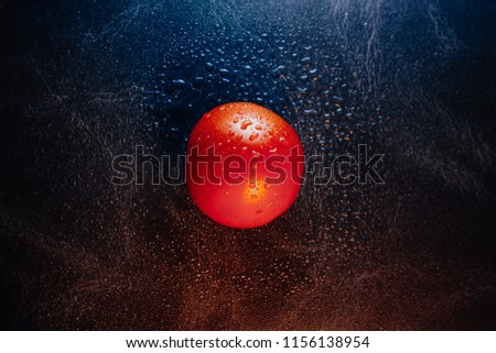 Tomato background with water.