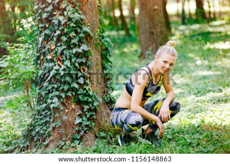 Woman resting in park after training