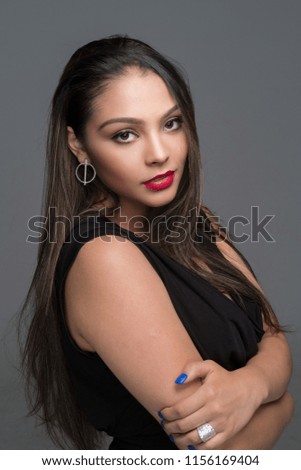 Female hispanic fashion model posing in the studio