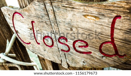 old closed sign at a fence