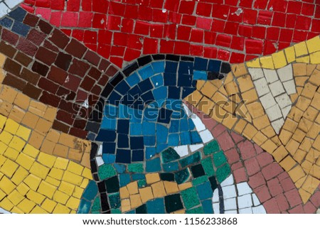 Detail of a beautiful old crumbling abstract ceramic mosaic decorated building. Venetian mosaic as a decorative background. Selective focus. Abstract pattern. Abstract mosaic colored ceramic stones