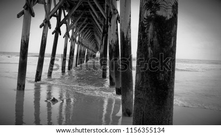 Black and white pier at the beach