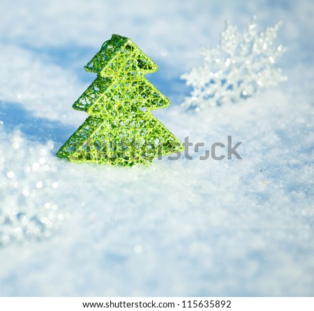 Christmas tree on snow. Winters background. Christmas card.