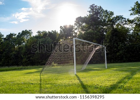 Soccer Net on Field Under Sunny Sky