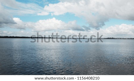 Water and clouds as background / Water is the transparent, tasteless, odorless, and nearly colorless chemical substance that is the main constituent of Earth's streams, lakes, and oceans