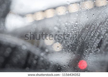 Selective focus of Rain drops on car window glass texture background