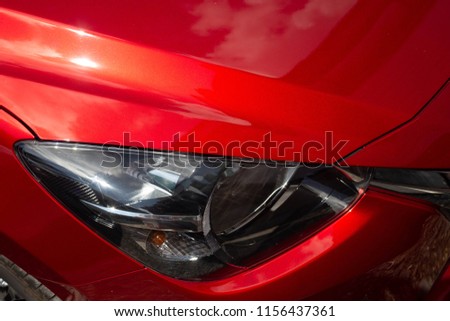 Headlight, red car