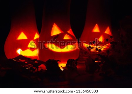 halloween candles and pumpkins in the dark