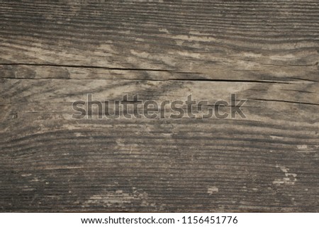 Dark grey extreme distressed weathered wood texture.