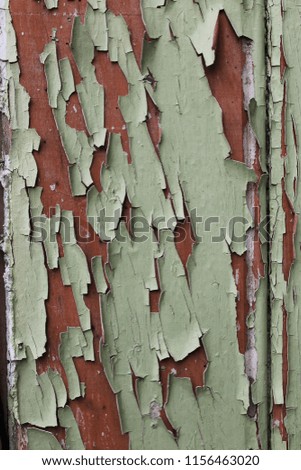 Flaky Green Paint over Rust Red Wood