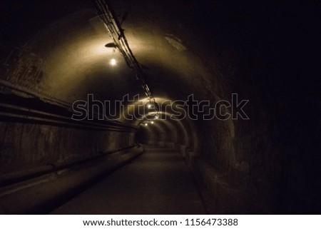 Dark tunnel with light at the end.
