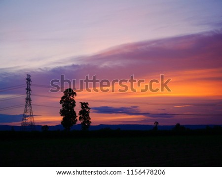 Sunset and electricity high tower