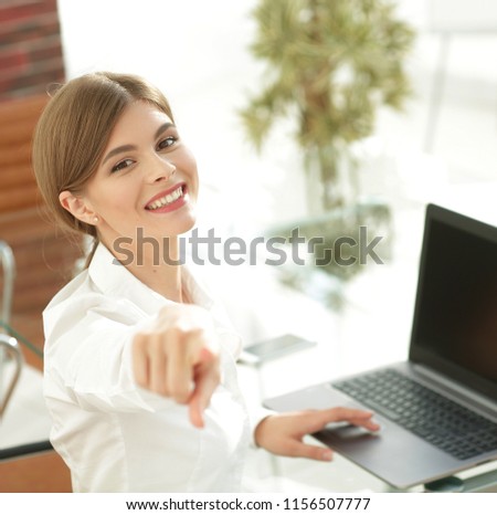 closeup portrait of young business woman at the workplace