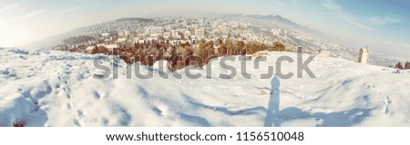 Snowy landscape with Nitra city, Slovak republic. Panoramic photo. Beautiful seasonal scene. Yellow photo filter.