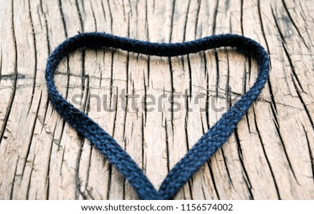Rope make heart on wood