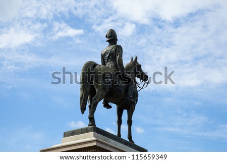 Monumental equestrian statue. In the middle of the picture in the background is the sky on a clear day.