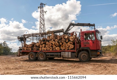 Timber for transportation (loading a truck)
