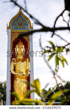 Buddha Statue standing at Wat Phok Ruam, Singburi Province, Thailand.