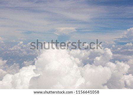 top view from window of airplane flying in clouds