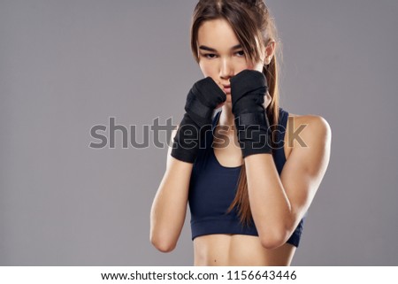 woman with bandaged hands black ribbon boxing sport                      