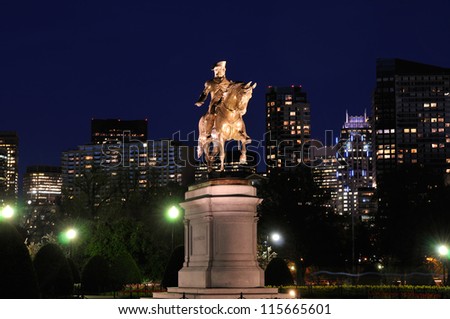 Boston Public Garden and city skyline at night