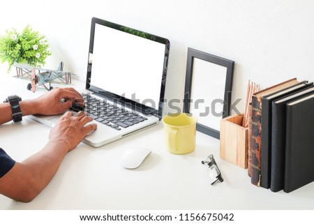 Businessman is sitting on the desk.