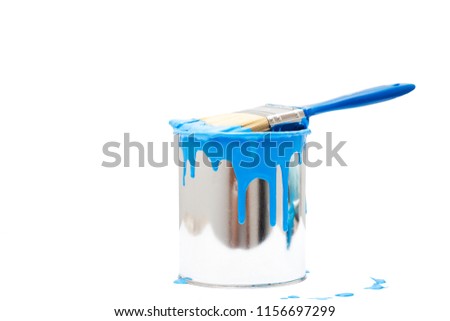 open, painted bucket and paintbrush on a white backdrop. Royalty-Free Stock Photo #1156697299