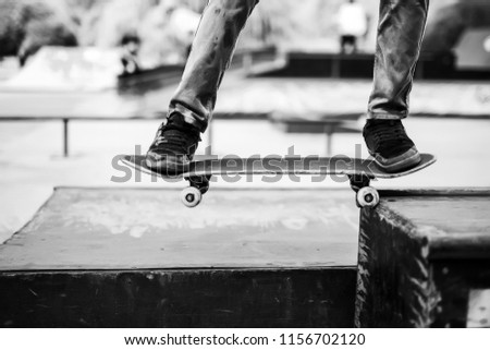 the guy is riding skateboard. Background
