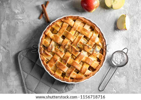 Composition with delicious apple pie on light background Royalty-Free Stock Photo #1156718716