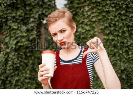 negative emotions woman with a white glass in her hand                           