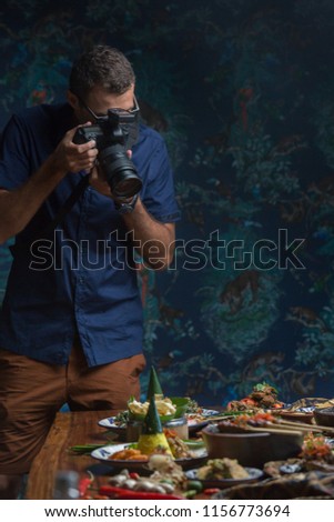 Professional food-photographer making shot of food for advert. Food photography concept