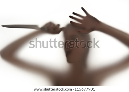 silhouette of a woman with a knife- danger concept