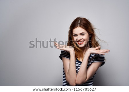  happy woman gesturing with her hands striped shirt emotions                              