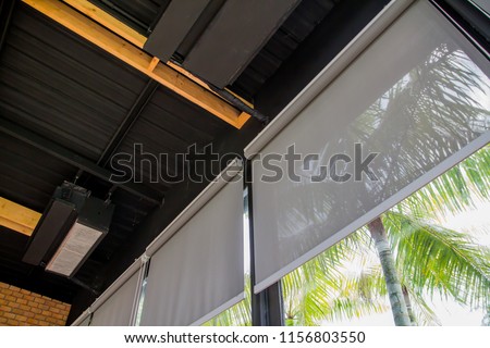 curtain or blinds Roller sun protection and big Glass windows. Royalty-Free Stock Photo #1156803550