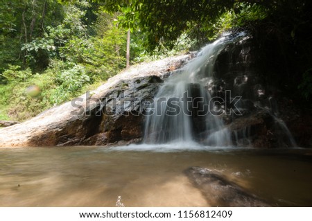 Selangor, MALAYSIA: Rivers and waterfalls in Sungai Tua Forest Park, Selangor. Images contain noise and soft focus.