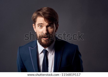 surprised look man in suit and tie                             