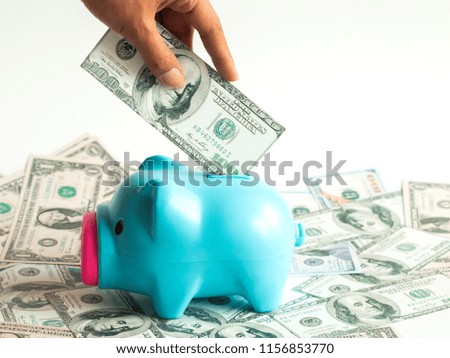 hand putting money into piggy bank. Deposit photo