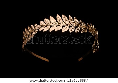 golden laurel wreath headband isolated on black
