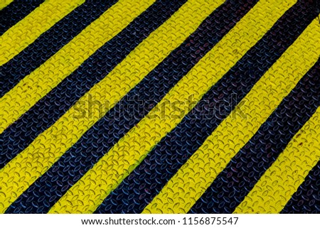 Steel sheet with yellow and black strip background