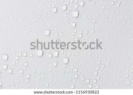 Close up of water drops on gray tone background. Abstarct black wet texture with bubbles on window glass surface or grunge. Raindrop, Realistic pure water droplets condensed for creative banner design