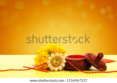 Raksha bandhan rakhi with flower and kumkum Royalty-Free Stock Photo #1156967227