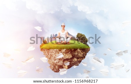 Woman in white clothing keeping eyes closed and looking concentrated while meditating on island in the air among flying paper planes with cloudy skyscape on background. 3D rendering.