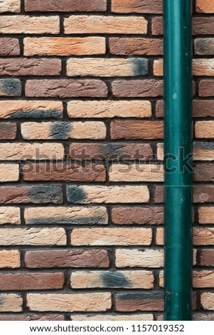 brick wall and drainpipe as background