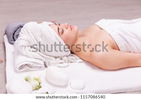 A relaxing massage for a woman.Young beautiful woman at the spa salon