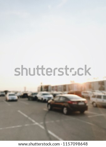 car parking at a shopping center, supermarket. cars in the parking lot. Abstract blurred car in parking background. illustration to article of Parking lot. blurred photo. vintage photo processing