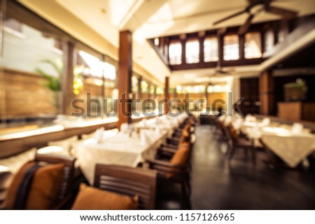 Abstract blur restaurant and coffee shop cafe interior for background