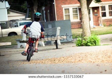 kid riding a bike