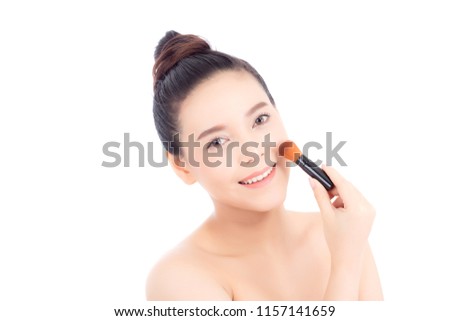 Beauty of portrait asian woman applying make up with brush of cheek isolated on white background, beautiful of girl holding blusher, skincare and cosmetic concept.