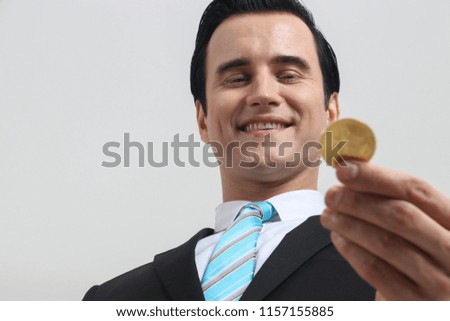 Businessman received a lot of money, businessmen holding Bitcoin Bitcoin on the white background, the concept of digital money.